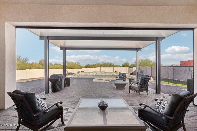 8523 N 192nd Ave, Waddell, AZ 85355 - view of patio with an outdoor living space and a fenced backyard
