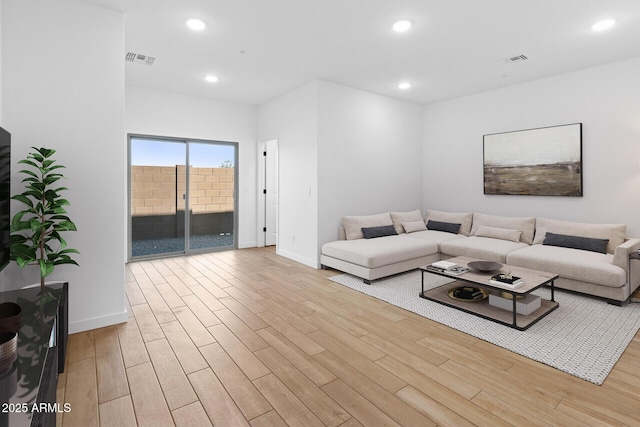 living room with light hardwood / wood-style flooring