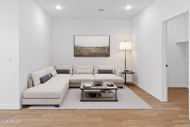 living room with light hardwood / wood-style flooring