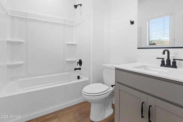 full bathroom featuring shower / bathtub combination, vanity, toilet, and hardwood / wood-style floors