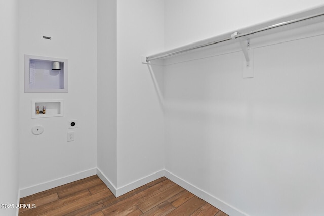 laundry area featuring gas dryer hookup, washer hookup, dark hardwood / wood-style floors, and hookup for an electric dryer