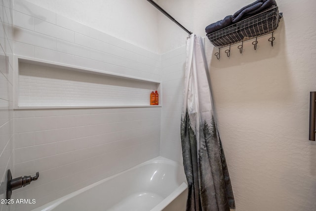 bathroom with shower / bath combination with curtain