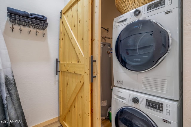 clothes washing area with stacked washer / drying machine