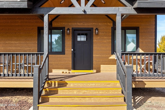 entrance to property with a porch