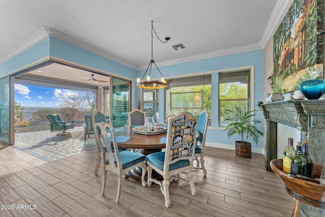 dining space with an inviting chandelier and crown molding