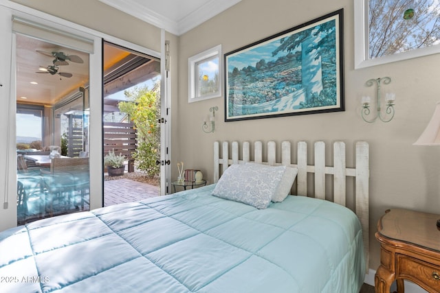 bedroom with crown molding and access to outside