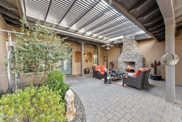 view of patio with an outdoor living space with a fireplace and a pergola