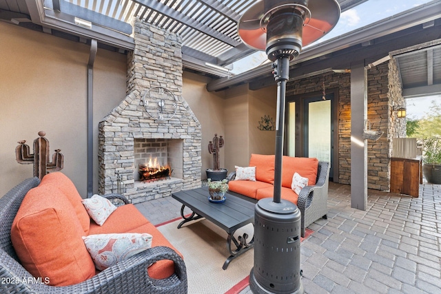 view of patio with an outdoor stone fireplace