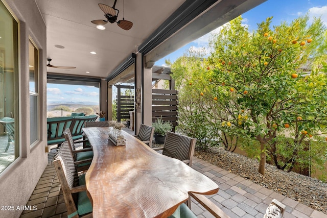 view of patio featuring ceiling fan