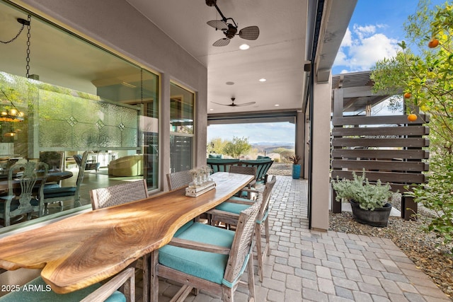 view of patio / terrace featuring ceiling fan