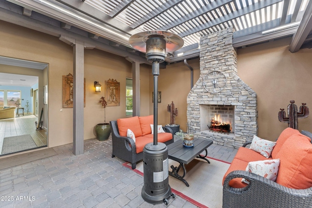 view of patio / terrace featuring a pergola and an outdoor living space with a fireplace