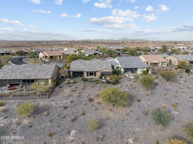 drone / aerial view featuring a mountain view