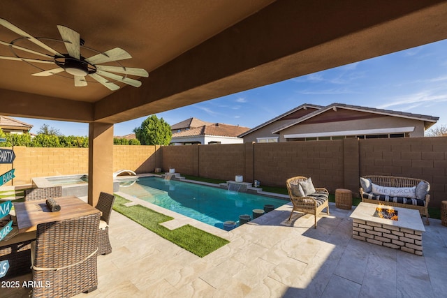 view of pool featuring ceiling fan, a fenced backyard, a fire pit, a fenced in pool, and a patio area