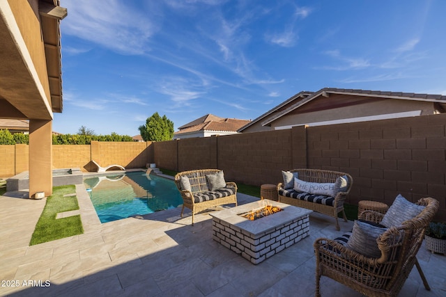 view of patio / terrace with a fenced in pool, an outdoor living space with a fire pit, and a fenced backyard