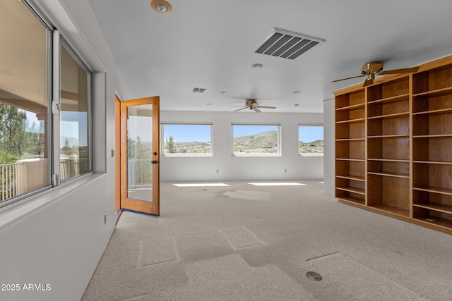 651 Chaparral Rd, Wickenburg, AZ 85390 - spare room with a ceiling fan, light colored carpet, and visible vents