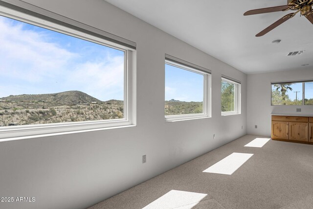 651 Chaparral Rd, Wickenburg, AZ 85390 - interior space with ceiling fan, a mountain view, and visible vents