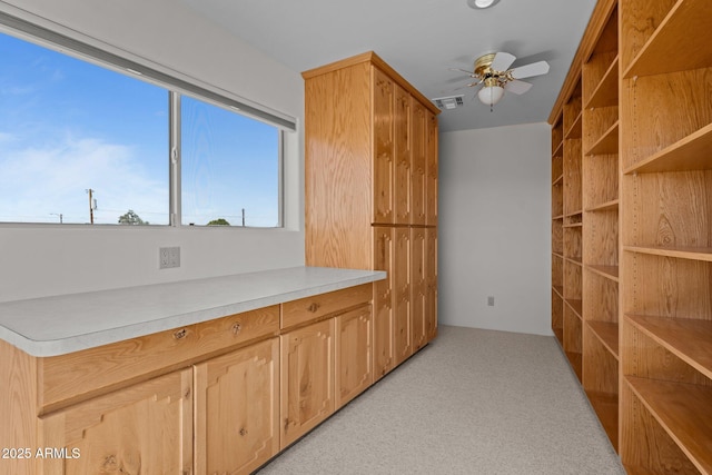 651 Chaparral Rd, Wickenburg, AZ 85390 - kitchen featuring light countertops, ceiling fan, visible vents, and light carpet