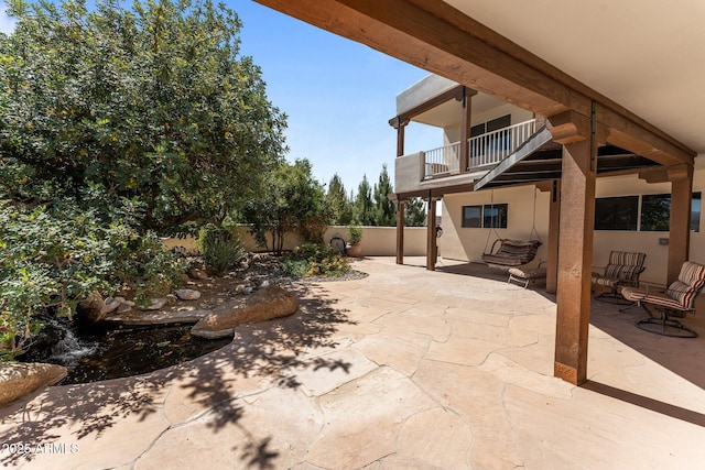 651 Chaparral Rd, Wickenburg, AZ 85390 - view of patio / terrace featuring a balcony and a fenced backyard