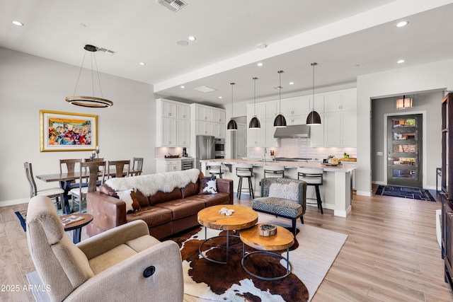 16134 E Ridgestone Dr, Fountain Hills, AZ 85268 - living room featuring recessed lighting and light wood-style flooring