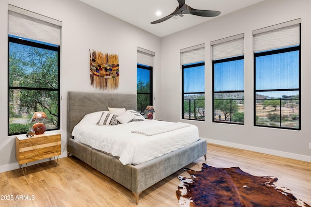 16134 E Ridgestone Dr, Fountain Hills, AZ 85268 - bedroom with light wood-style floors, multiple windows, and ceiling fan