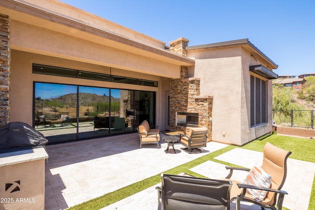 16134 E Ridgestone Dr, Fountain Hills, AZ 85268 - view of patio featuring an outdoor living space with a fireplace