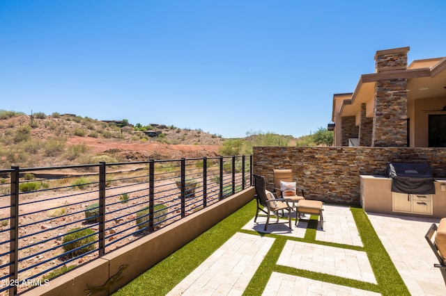 16134 E Ridgestone Dr, Fountain Hills, AZ 85268 - view of yard with exterior kitchen and a patio