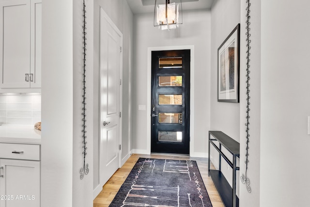 16134 E Ridgestone Dr, Fountain Hills, AZ 85268 - foyer with light wood finished floors and a chandelier