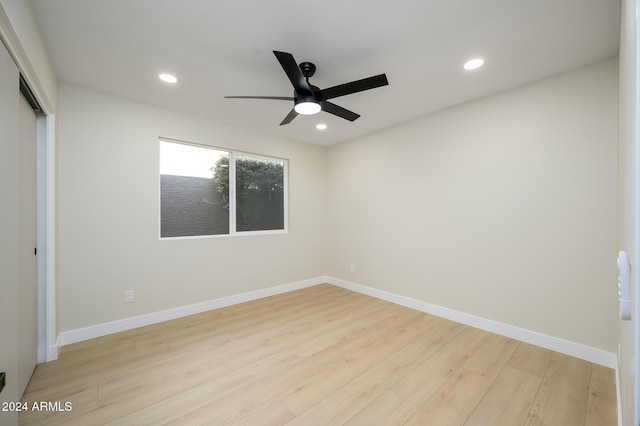 unfurnished bedroom with light hardwood / wood-style flooring, a closet, and ceiling fan