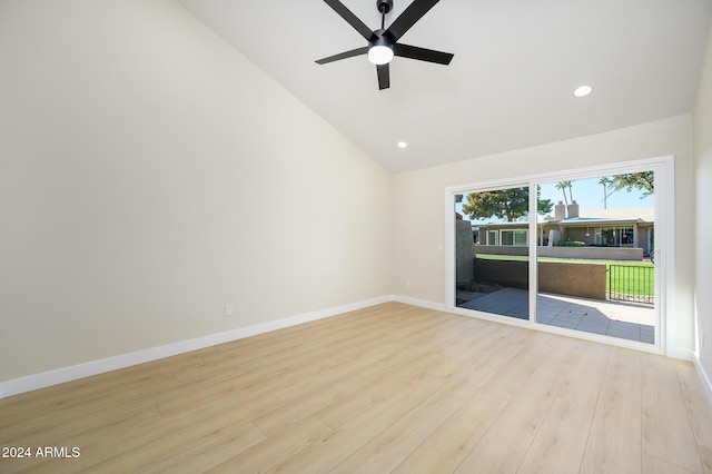 spare room featuring light wood-type flooring, ceiling fan, and high vaulted ceiling