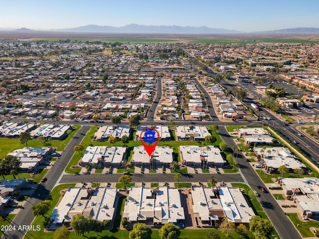 birds eye view of property with a mountain view