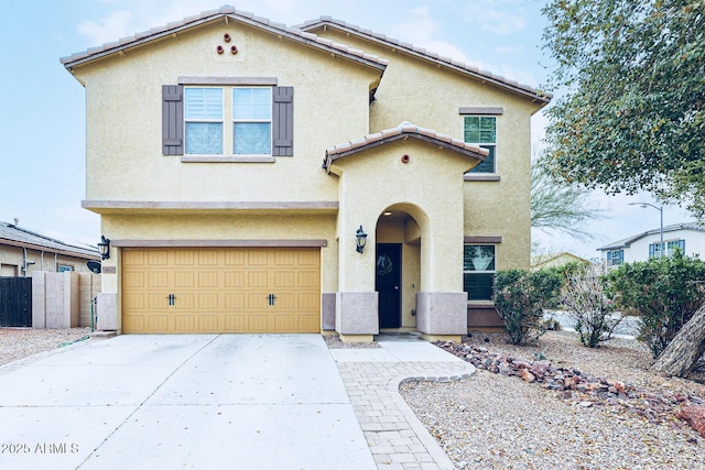 mediterranean / spanish-style home with a garage