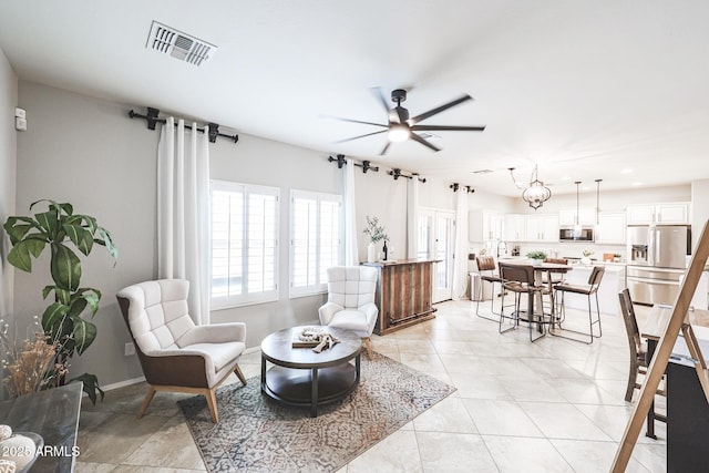 tiled living room featuring ceiling fan