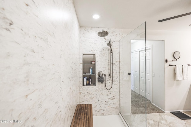 bathroom featuring tile patterned floors, ceiling fan, and walk in shower