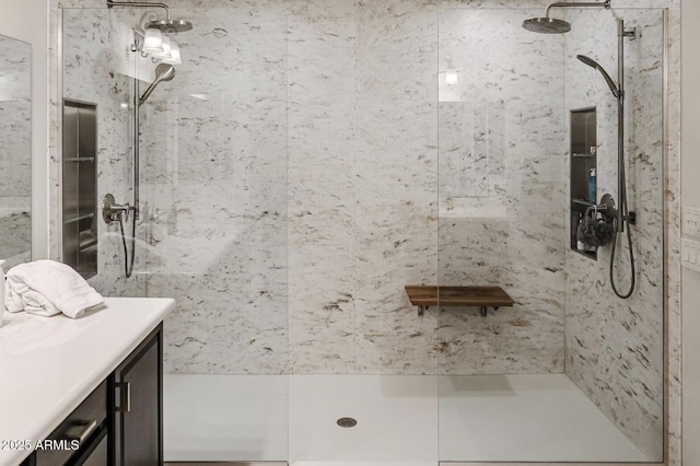 bathroom featuring vanity and a tile shower