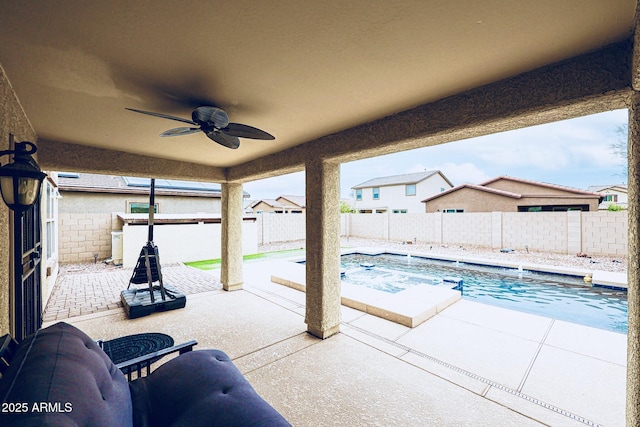 view of pool with ceiling fan and a patio area