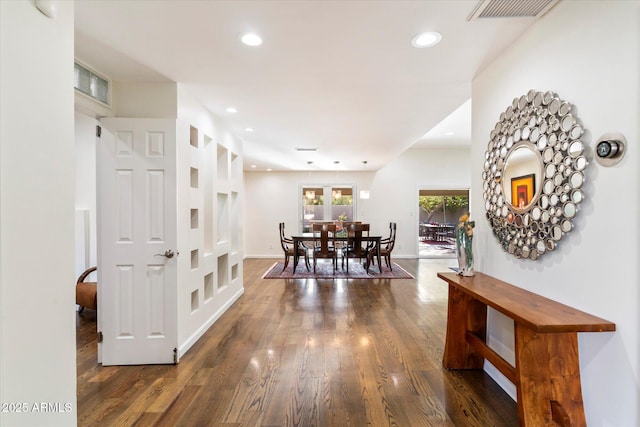 dining space featuring dark wood-type flooring