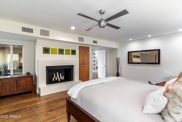 bedroom featuring dark wood-type flooring and ceiling fan