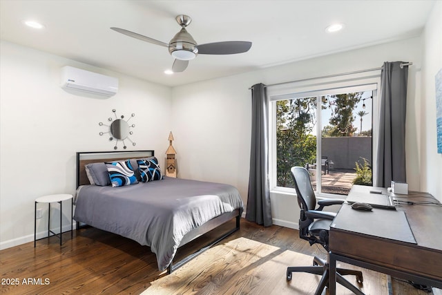 bedroom with ceiling fan, dark hardwood / wood-style floors, and a wall mounted AC