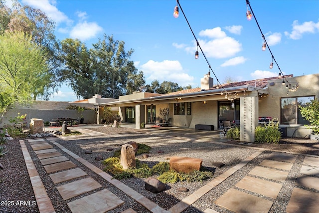 rear view of property with a patio area