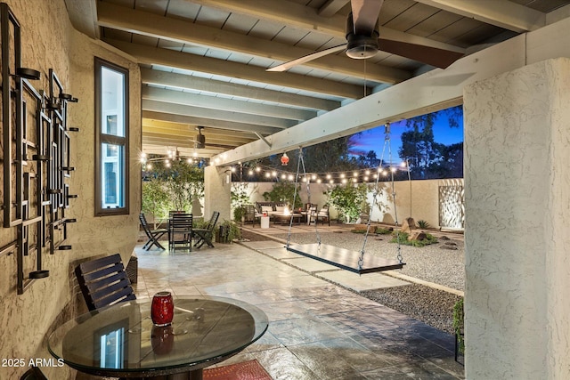 patio terrace at dusk with ceiling fan