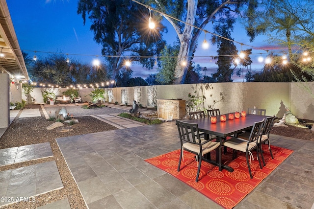 view of patio terrace at dusk