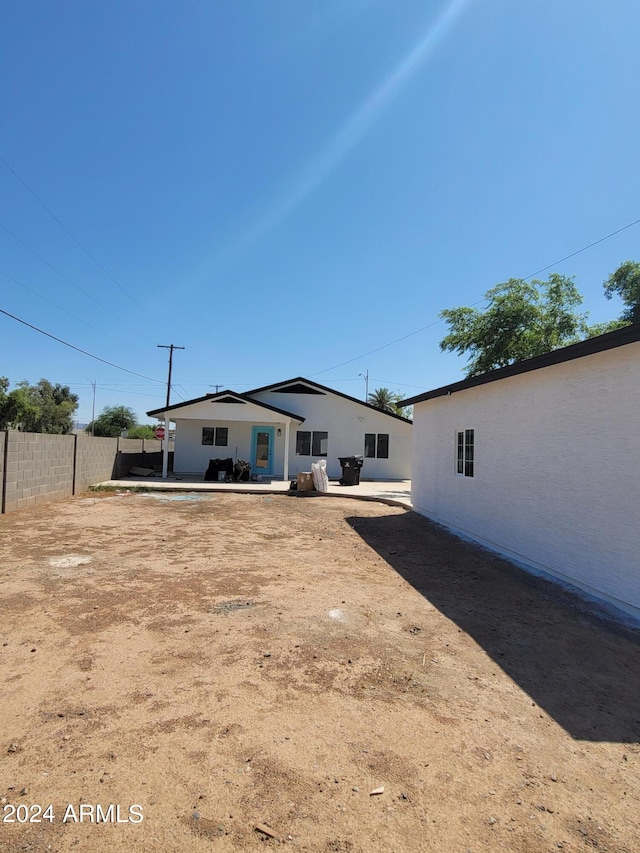 rear view of house with a patio