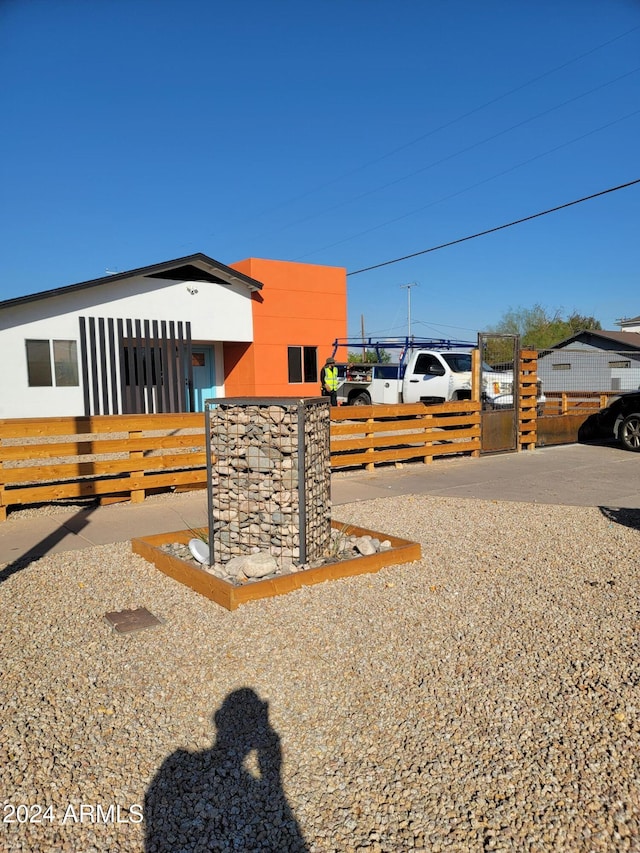 2002 W Adams St, Phoenix, AZ 85009 - view of property exterior with a gate and a fenced front yard