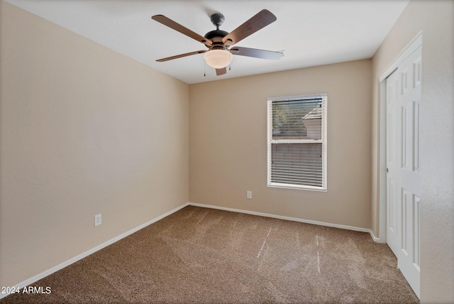 unfurnished bedroom featuring ceiling fan, carpet floors, and a closet