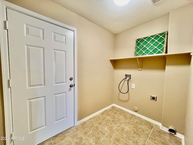 washroom with washer hookup, hookup for an electric dryer, tile patterned flooring, and hookup for a gas dryer