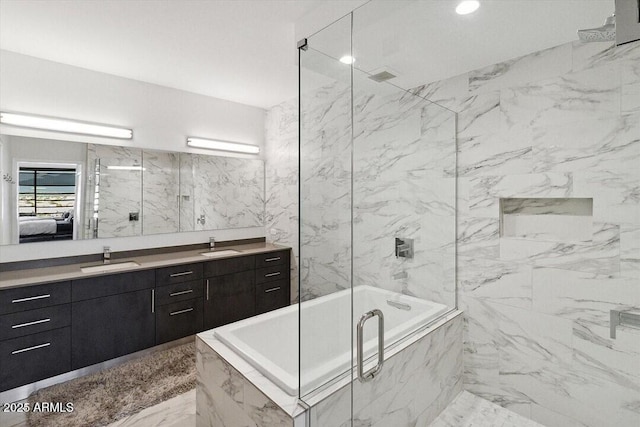 7180 E Kierland Blvd Unit 916, Scottsdale, AZ 85254 - full bathroom with a tub with marble appearance, vanity, a marble finish shower, and ensuite bath