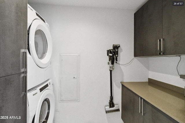 7180 E Kierland Blvd Unit 916, Scottsdale, AZ 85254 - laundry room with stacked washer and clothes dryer and cabinet space