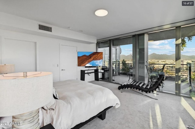 7180 E Kierland Blvd Unit 916, Scottsdale, AZ 85254 - carpeted bedroom featuring floor to ceiling windows and access to exterior