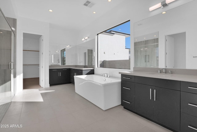 bathroom with vanity, separate shower and tub, and tile patterned floors