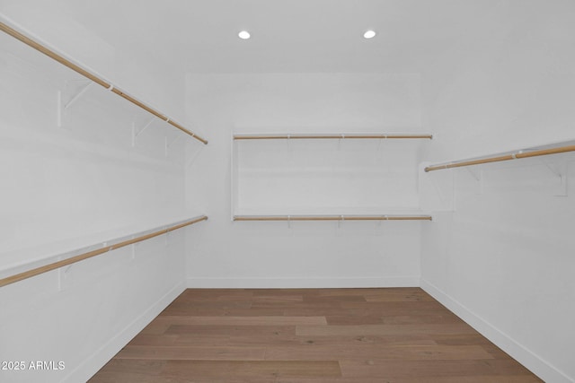 walk in closet featuring hardwood / wood-style floors